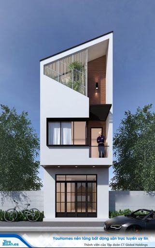 Mái nhọn ấn tượng của nhà ống kết hợp với đường nét cắt mở phần mặt tiền.