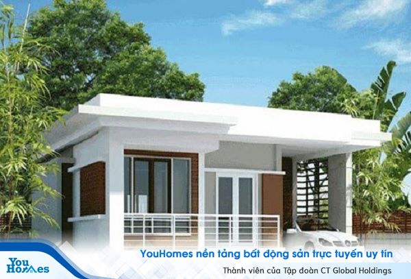 Mẫu nhà cấp 4 mái bằng ở nông thôn có gara ô tô nổi bật với gam màu trắng tươi sáng, nhẹ nhàng.