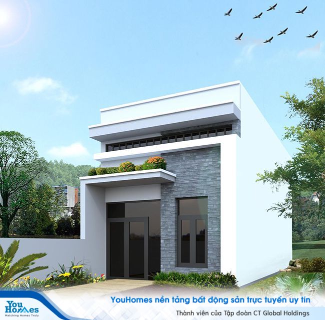 Bậu cây hoa phía cửa nhà ống cấp 4 có gác lửng giúp cho ngôi nhà có thêm màu sắc. 