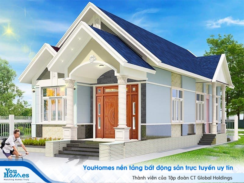 Cửa ra vào bằng gỗ giúp cho ngôi nhà cấp 4 mái thái trở nên sang trọng hơn. 